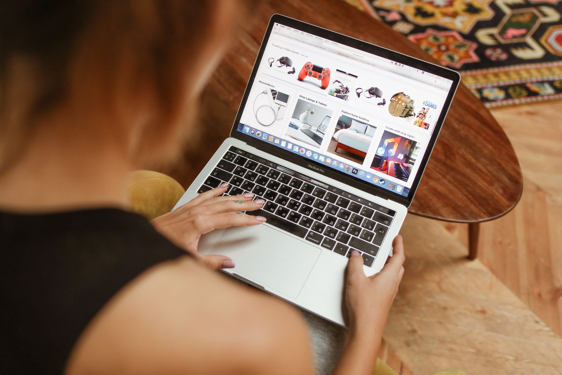 Woman browsing an online shop on a laptop at home