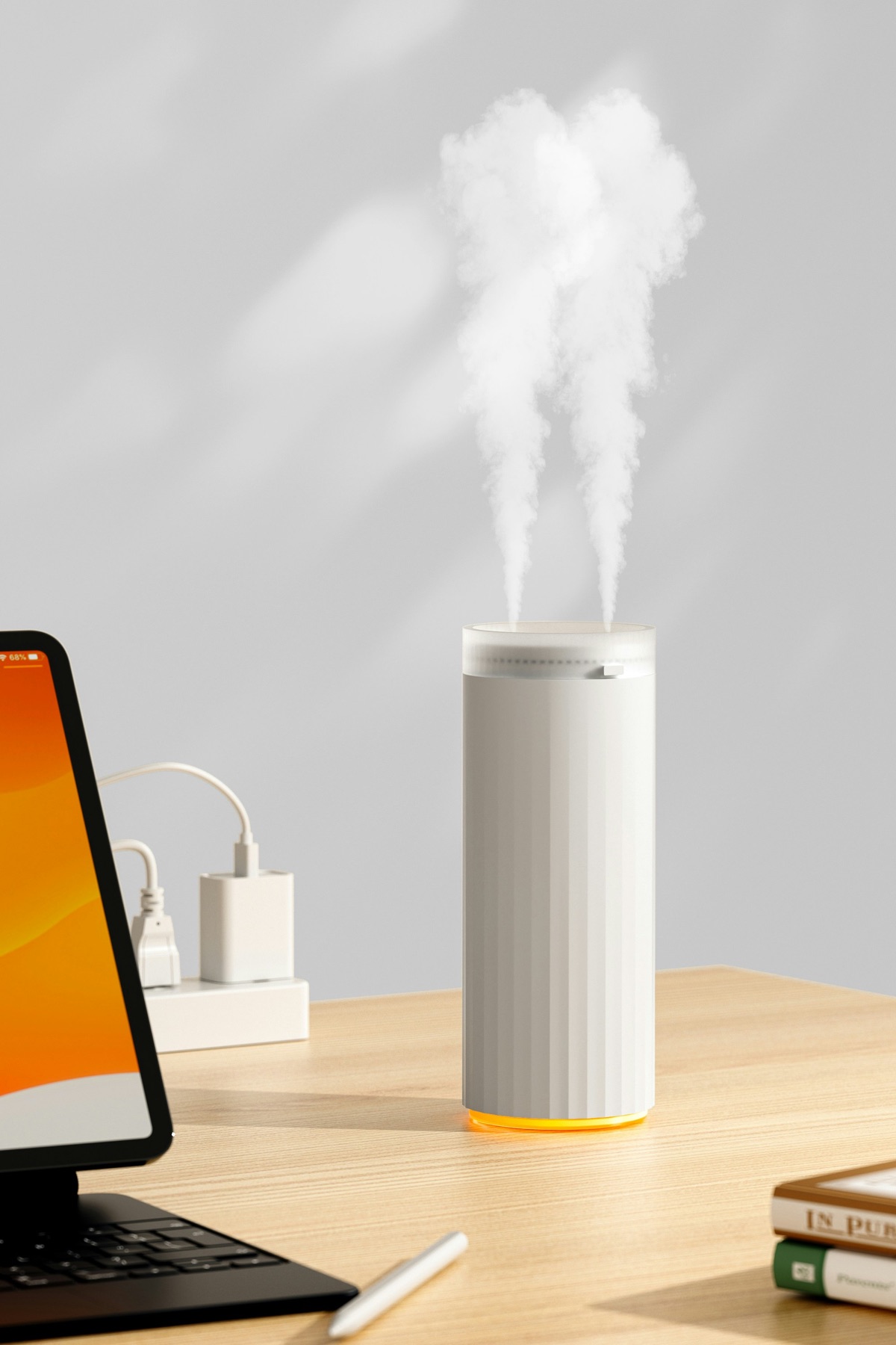 White humidifier releasing a steady mist on a wooden desk