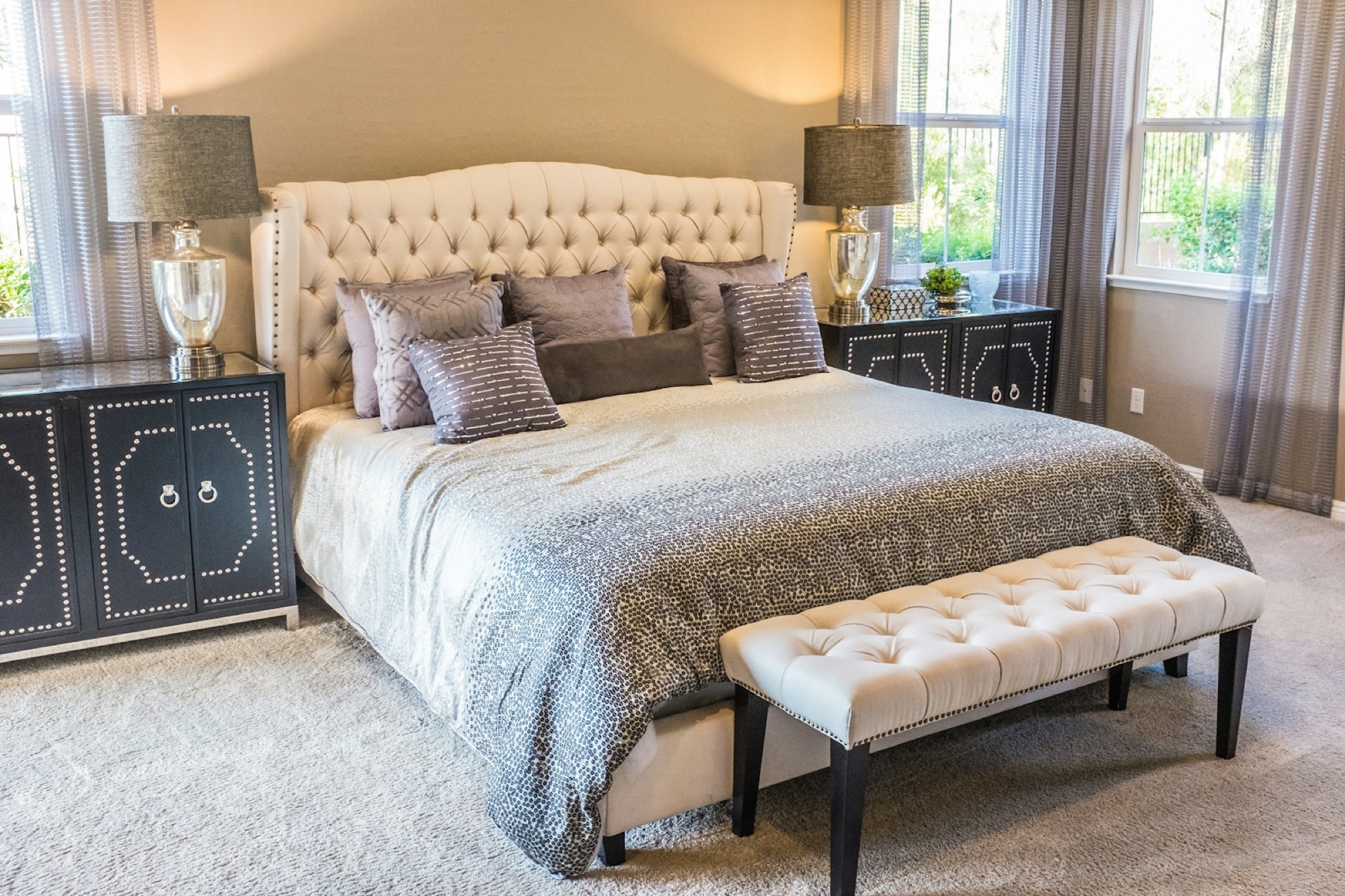 Layered mattress in a calm bedroom with firmness scale graphic