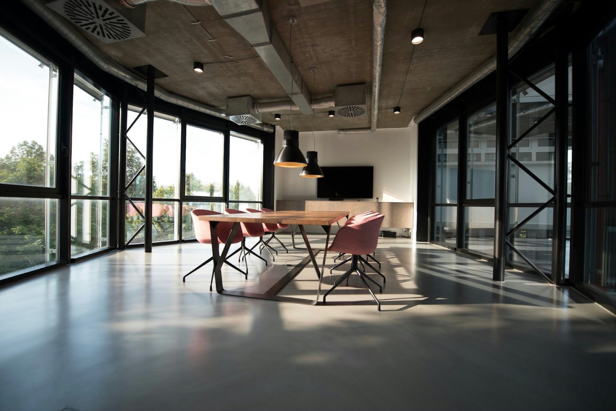 Adjustable office chair beside a desk in a home workspace