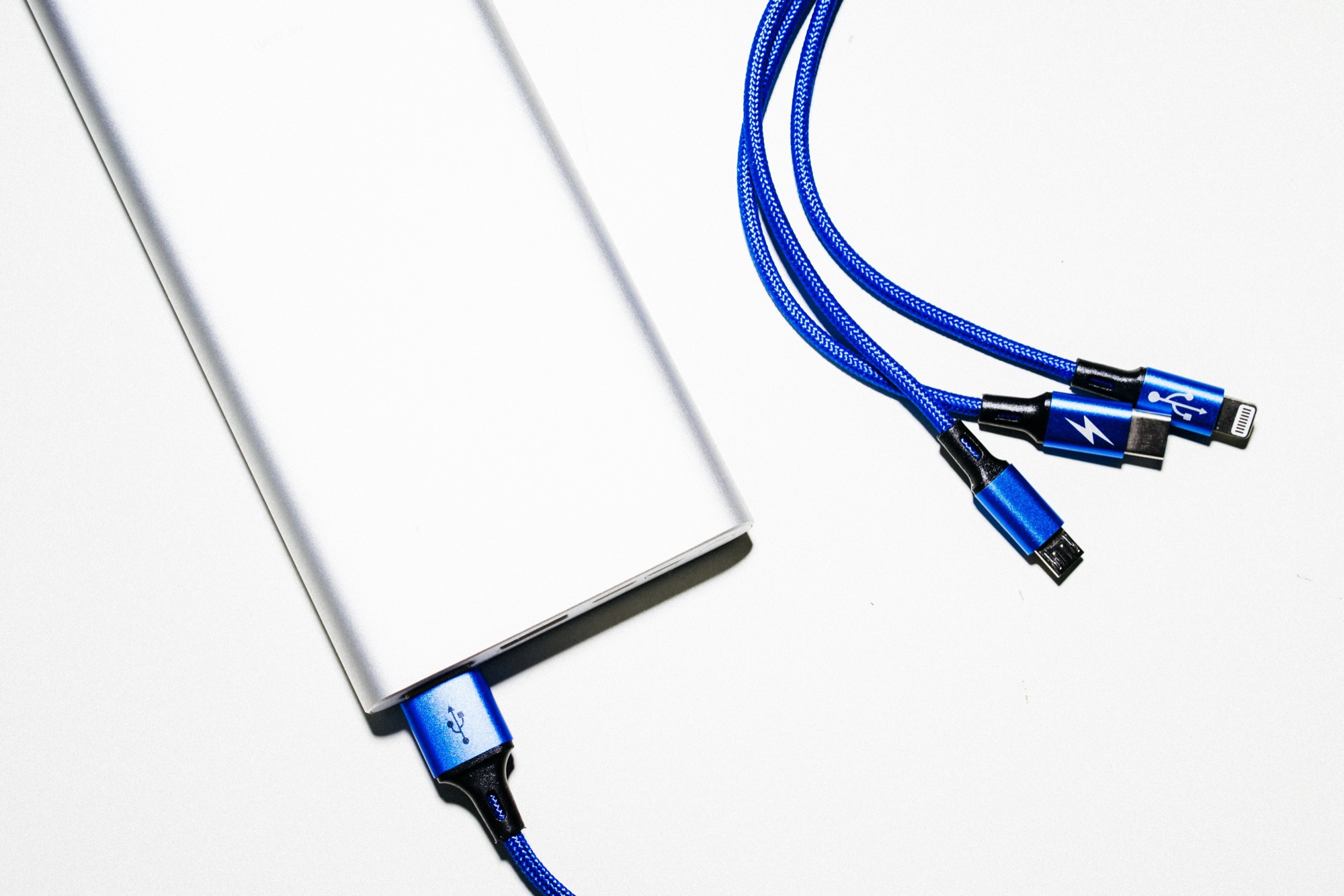 Compact power bank charging a smartphone through USB-C