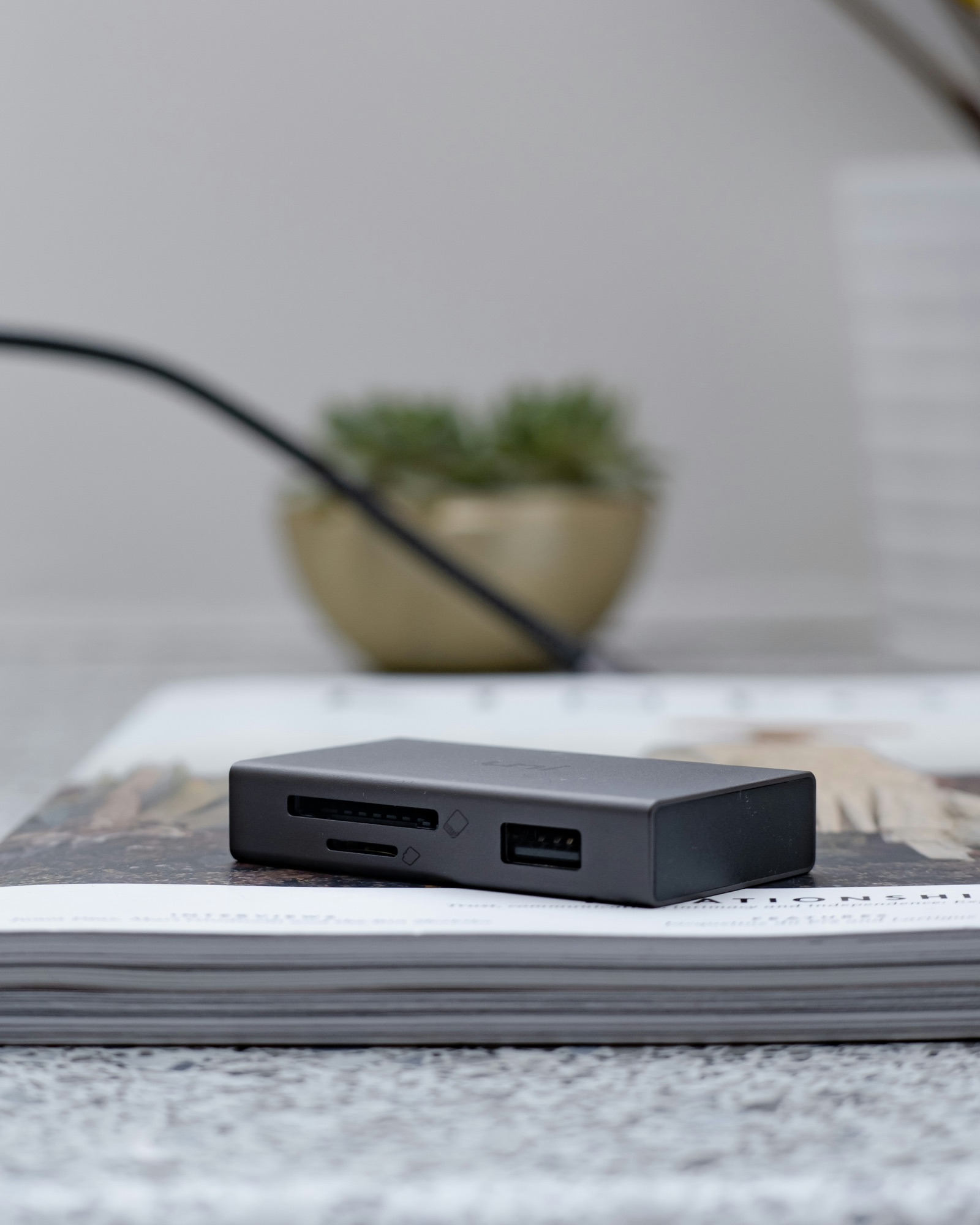 Compact USB-C hub beside a powered desktop docking station