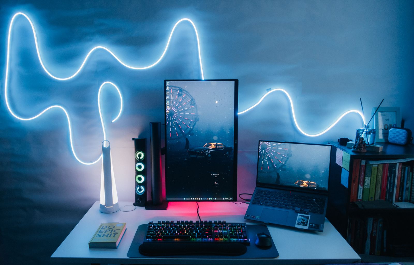 Desk setup with a laptop and a monitor rotated vertically